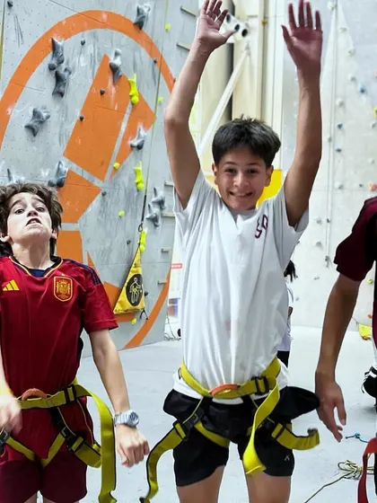 Three friends celebrate after a fun climbing session. The community and friendships built here are just as important as the climbing itself.