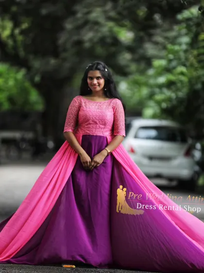 A front view of the pink and purple dual-tone gown. The lace detail on the bodice adds a touch of romance to this bold and colorful piece.