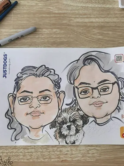 A live caricature of two friends and their fluffy companion.