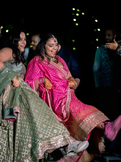 A fun moment from the Mehandi night, with the bride and her friends showing off their dance moves.