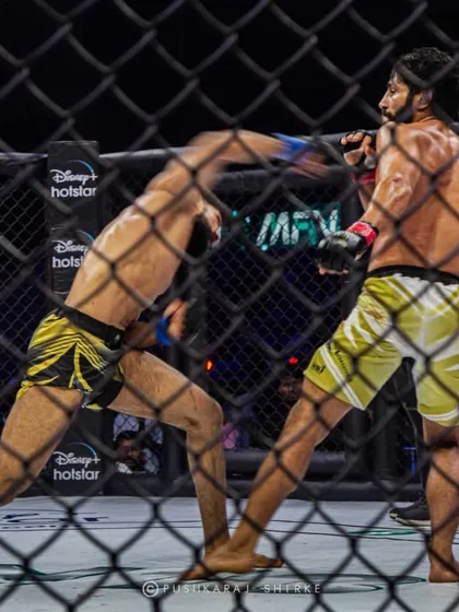 A dynamic shot of Shyamanand throwing a spinning attack, showcasing the diverse striking skills in modern Indian MMA.