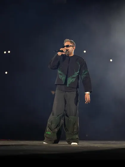 A full-stage shot of Yo Yo Honey Singh, showing his commanding presence. This type of photo is great for promotional materials.