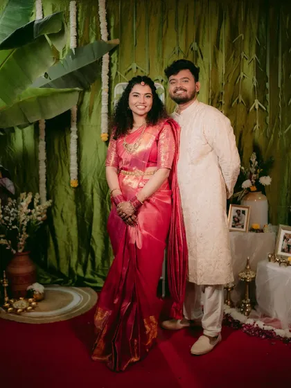 A classic portrait of a couple on their engagement day, dressed in beautiful traditional South Indian attire.