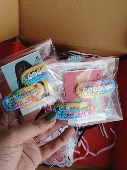 Holding up a fresh batch of personalized name clips for Aoy and Aouke. Each one is made with love and attention to detail.