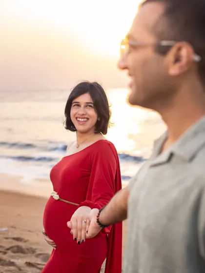 A candid, happy moment between partners. This "follow me" style shot adds a sense of adventure and shared journey to your maternity album.