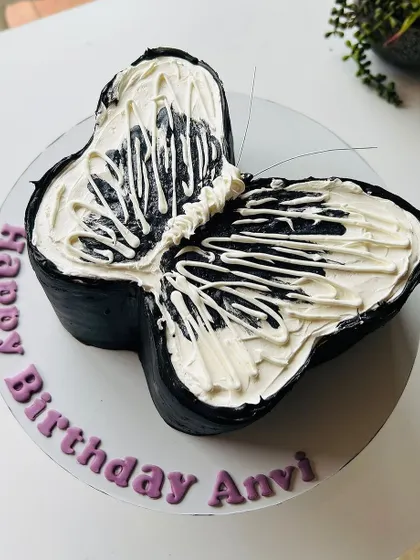 Another angle of the striking black and white butterfly-shaped cake.