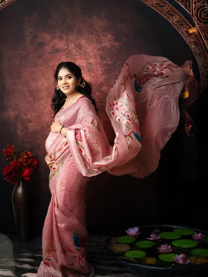 I love creating these timeless portraits where every detail feels like a brushstroke on a canvas. Here, the flowing pallu of the saree adds a touch of magic to this serene moment of anticipation.