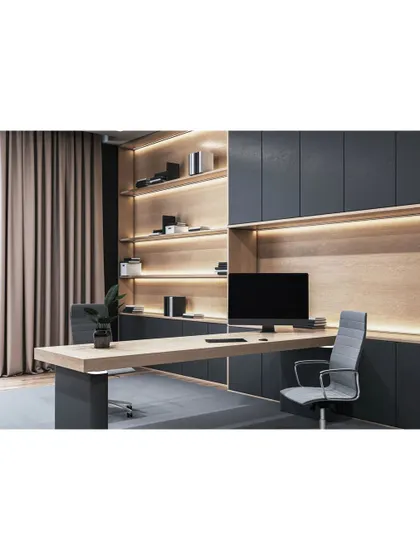 A sleek and modern home office. The design features a floating desk, dark cabinetry, and integrated LED strip lighting for a sophisticated and professional workspace.