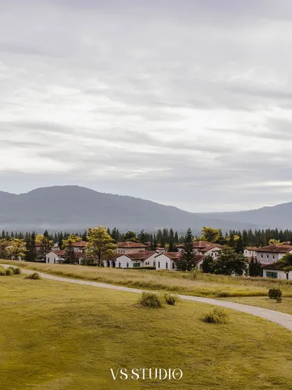 A beautiful landscape shot of a European-style village in Khao Yai, Thailand. This image sets the scene for a romantic pre-wedding story, showcasing the stunning locations we find for our shoots.
