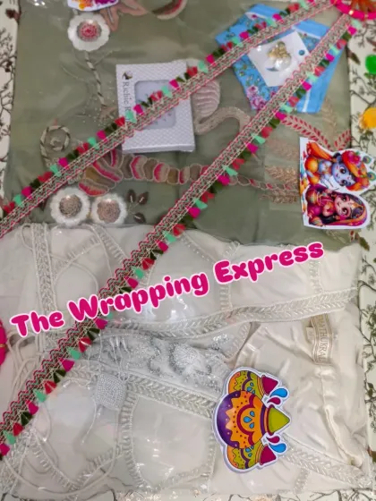A white suit packed for Holi, with colorful decorations that stand out against the light fabric.
