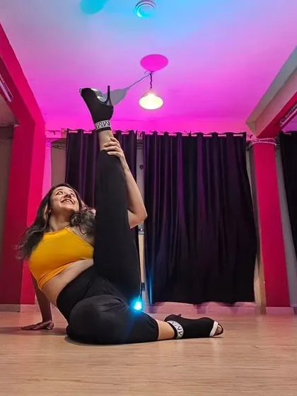 A moment of joy and flexibility in my happy place. This pose captures the feeling of freedom and strength that dancing in heels can give you, something I hope all my students experience.