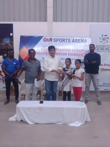 Our students from GMR Sports Arena receiving their awards at the annual Indoor Badminton Tournament.