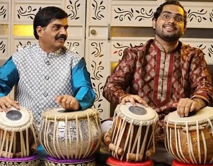 This is a cherished moment with my appa and guru, Pandit Rajgopal Kallurkar. Learning from him is the greatest blessing, as this art is a legacy passed down through my family. We are seen here in a tabla duet setting.