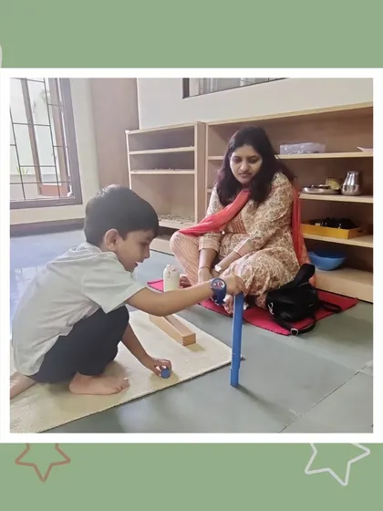 Tavish demonstrates his understanding of numbers with the spindle box, a core Montessori math material. His mother watches as he confidently counts and sorts, a proud moment for any parent.