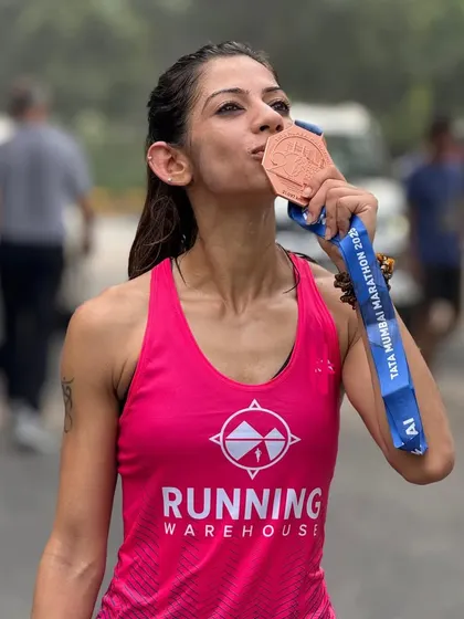 Kissing my third-place medal from the Tata Mumbai Half Marathon. Every medal is a symbol of the grit, sacrifice, and relentless determination that goes into training.