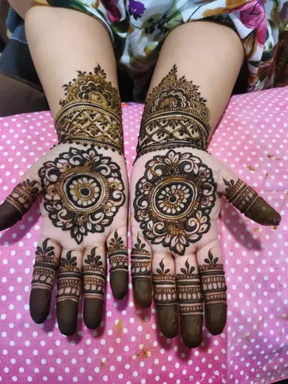 A classic mandala design, perfect for any festive occasion. The symmetry is beautiful.