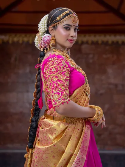 This view from the back showcases the traditional braided hairstyle, adorned with our rental hair accessories.
