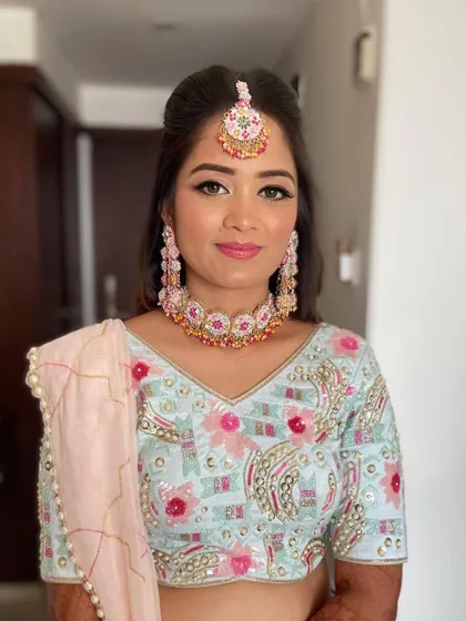 A portrait showcasing the beautiful details of her floral jewelry and the complementary makeup.