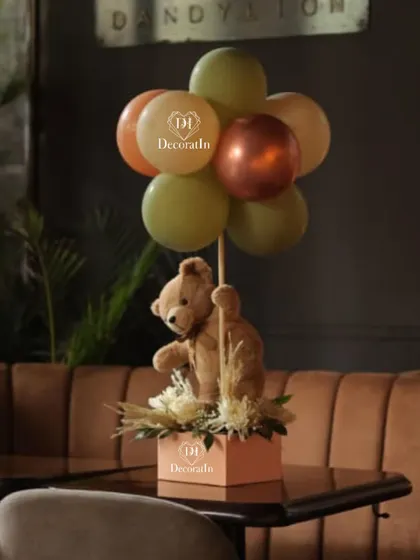 A teddy bear centerpiece seen in its restaurant setting, showing how our decor enhances the space.
