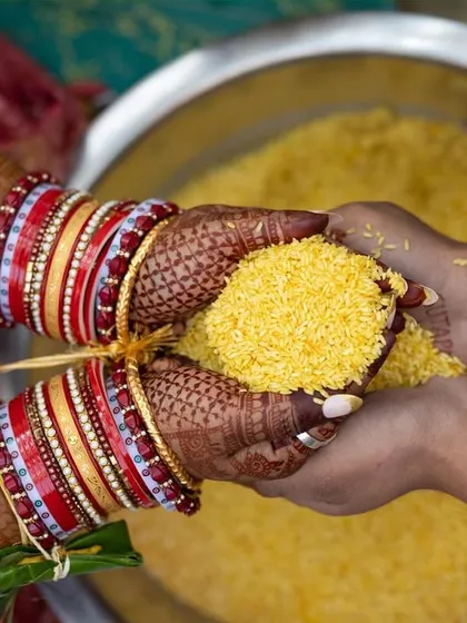 A close-up of a Telugu wedding ritual where the bride and groom hold rice in their hands. Capturing these intricate cultural details is a privilege and helps preserve the memory of these beautiful traditions.