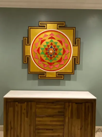The Shree Yantra art piece installed in our client's home in Australia. This image shows the artwork without backlighting, highlighting the clean lines and vibrant colors of the geometric design.