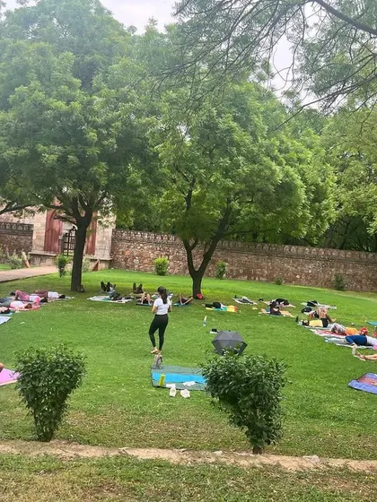 We love taking our practice outdoors. Here, we are leading a large group session in a serene park setting, perfect for corporate offsites or special wellness events. The open space and fresh air add another layer of rejuvenation to the yoga sadhana.