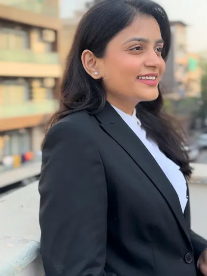 A smiling profile, reflecting my approachable nature. I am here to provide legal help and guidance to law students and clients alike.