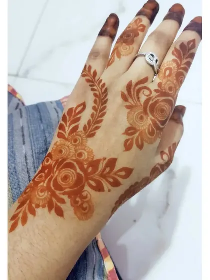 A beautiful floral design with a lovely, warm brown stain.