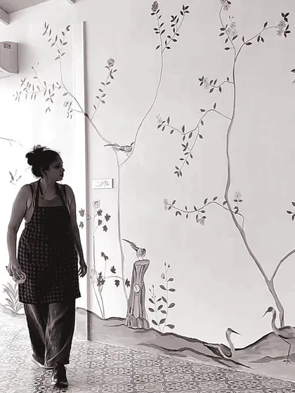 A duplicate image of me walking past the French mural.
