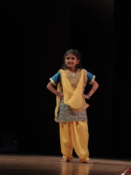 A 'Dancing Divaa' strikes a pose during her performance. Our traditional dance classes for kids are a great way to connect with culture.