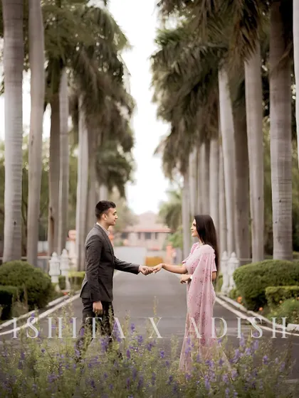A classic pre-wedding portrait set against a beautiful, tree-lined avenue. This type of shot adds a touch of formal elegance and romance to your wedding film.