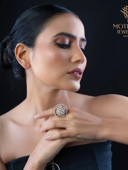 A classic cluster ring designed for maximum impact. The large surface area is completely covered in diamonds, creating a dazzling piece that is perfect for special occasions.