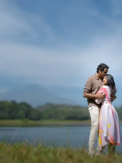 Sometimes, the most powerful stories are told in quiet places. This lakeside pre-wedding portrait uses the vastness of nature to frame an intimate embrace, showing how your love can feel like the calm in the center of the world.
