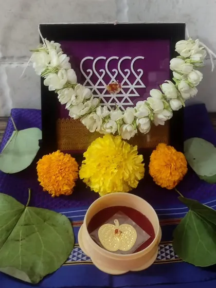 Another happy client's Dussehra puja setup, featuring my purple Saraswati frame adorned with a gajra.