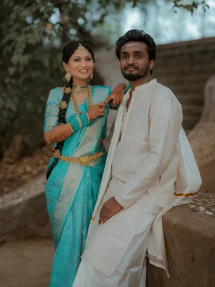A stylish couple portrait. The bride looks confident and beautiful in her traditional South Indian attire.