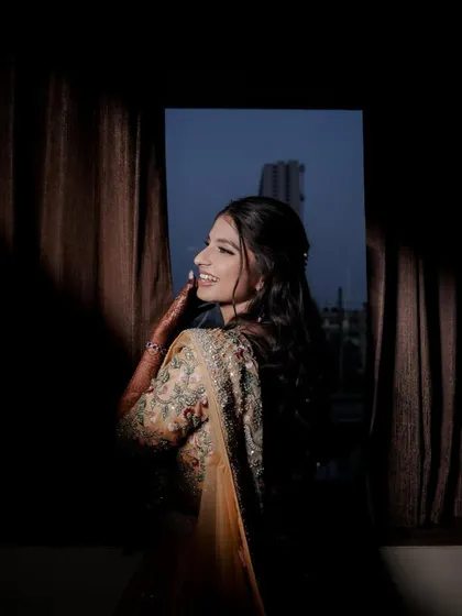 A beautifully lit portrait of an engagement bride. Her makeup features a soft glam eye and glowing skin, designed to catch the light perfectly and create a dreamy, ethereal effect.