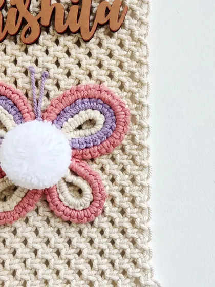 A side view of the butterfly name hanging.