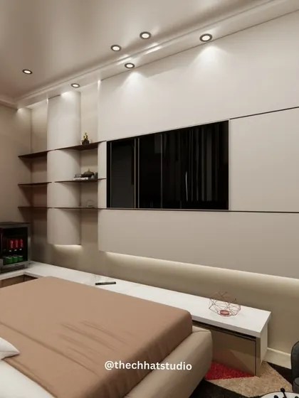 Smart storage and integrated amenities are key to a great hotel stay. This view shows the custom-built media wall with integrated shelving, a concealed mini-fridge, and soft backlighting, combining functionality with a clean, modern aesthetic.
