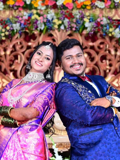 A fun, back-to-back pose by the happy couple at their wedding reception.