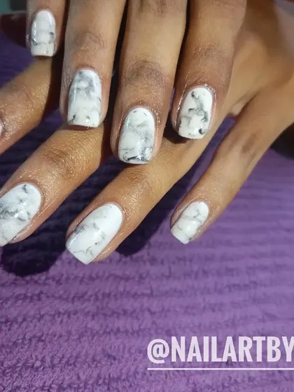 A classic white and grey marble nail art design. I hand-paint the delicate veins to mimic the look of real marble stone.
