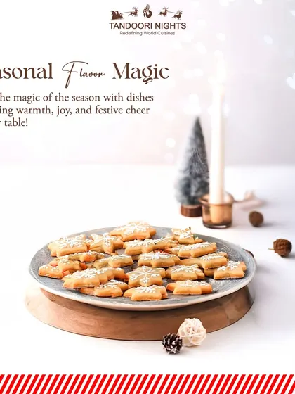 Seasonal flavor magic. A plate of star-shaped Christmas cookies, lightly dusted with powdered sugar, brings warmth and festive cheer to your holiday table.