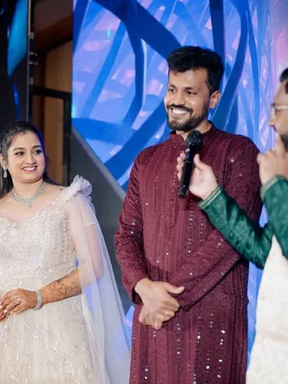 Sharing a laugh with the couple on stage. These unscripted, personal interactions are what make an event truly special.