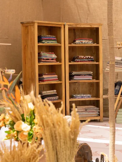 Shelves were stocked with folded pashminas and local textiles, allowing guests to immerse themselves in the bazaar experience.