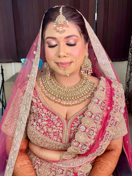 A close-up of this gorgeous bride's makeup. I used soft pink and gold tones on the eyes to complement her pink lehenga, creating a look that is both romantic and glamorous.