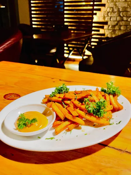 You can't go wrong with perfectly crispy and seasoned french fries, served with a creamy dip.
