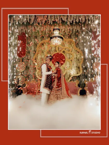 The Varmala moment, captured with grand pyrotechnics and a cloud of smoke, creating a spectacular scene.