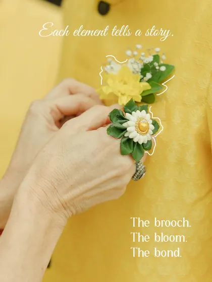 The brooch, the bloom, the bond. A mother's hands carefully pinning a boutonnière on her son's kurta is a quiet moment of love and care that speaks volumes.