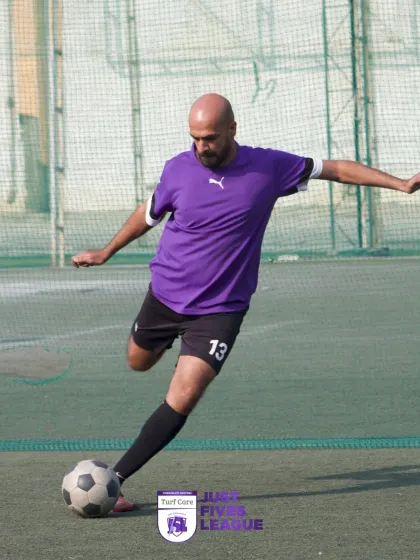 A player lines up a shot, demonstrating the power and precision required in football. Our events allow individuals to showcase their skills.