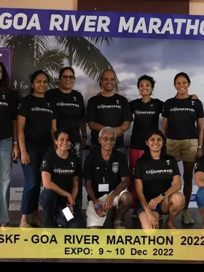 The team posing at the Goa River Marathon expo. We're not just a running group, we're a family that travels together.