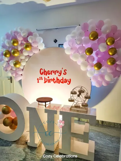 Another example of the "ONE" marquee letters, here used for "Cherry's 1st birthday" with pink and gold Mickey-ear balloon clusters.